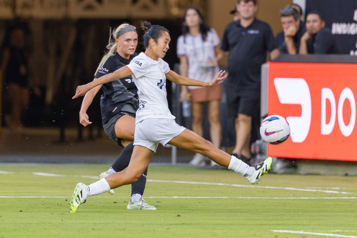 Caprice Dydasco #3 of Bay FC reaches for the ball while being defended by Riley Tiernan #33 of Angel City FC during an NWSL match at BMO Stadium on September 1, 2025 in Los Angeles, California.