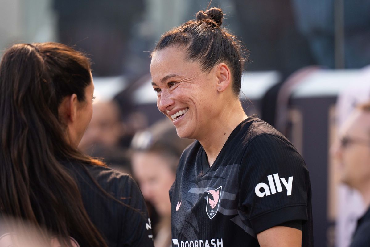 Angel City FC defender Ali Riley becomes emotional as she greets her teammates before her final match, Sunday, Oct. 19, 2025, at BMO Stadium in Los Angeles, Calif.