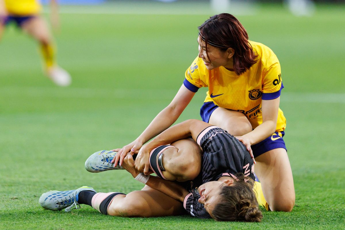 Miyabi Moriya #22 of the Utah Royals takes down Nealy Martin #14 of Angel City FC during an NWSL match against Angel City FC on May 2, 2026 at BMO Stadium in Los Angeles, California.