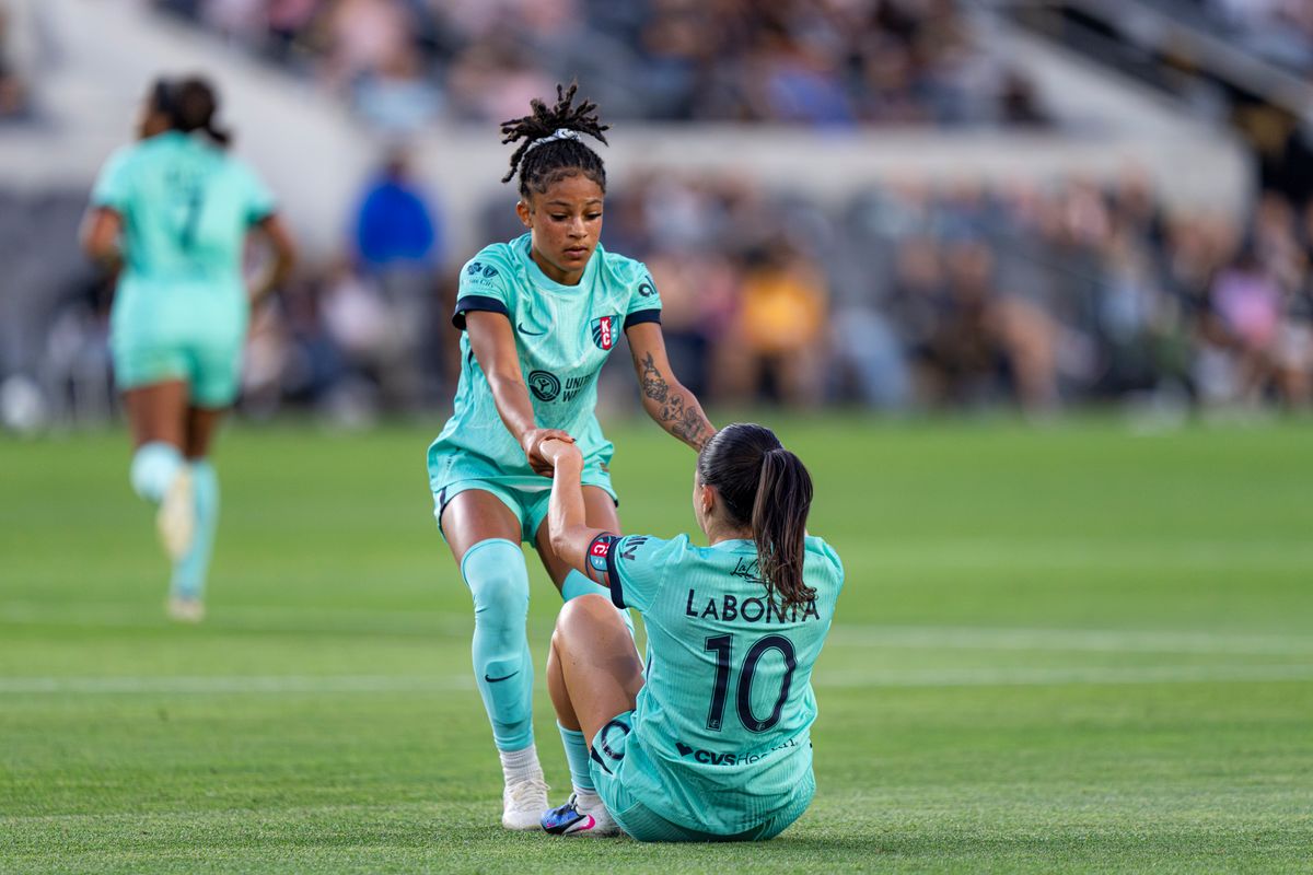 Kansas City Current midfielder Lo'Eau LaBonita (10) being helped up after being fouled during an NWSL game against Angel City FC on Wednesday May 20th, 2026 in Los Angeles, California.