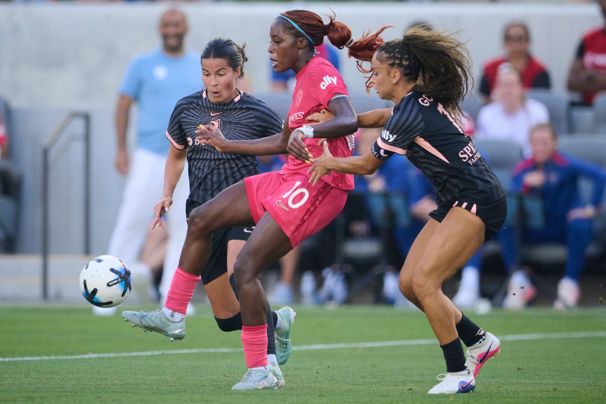 The Angel City FC Defender Sarah Gorden #11 and Defender Emily Sams #6 fight for the ball during an NWSL game against The North Carolina Courage on May 31st, 2026 at BMO Stadium in Los Angeles, California.
