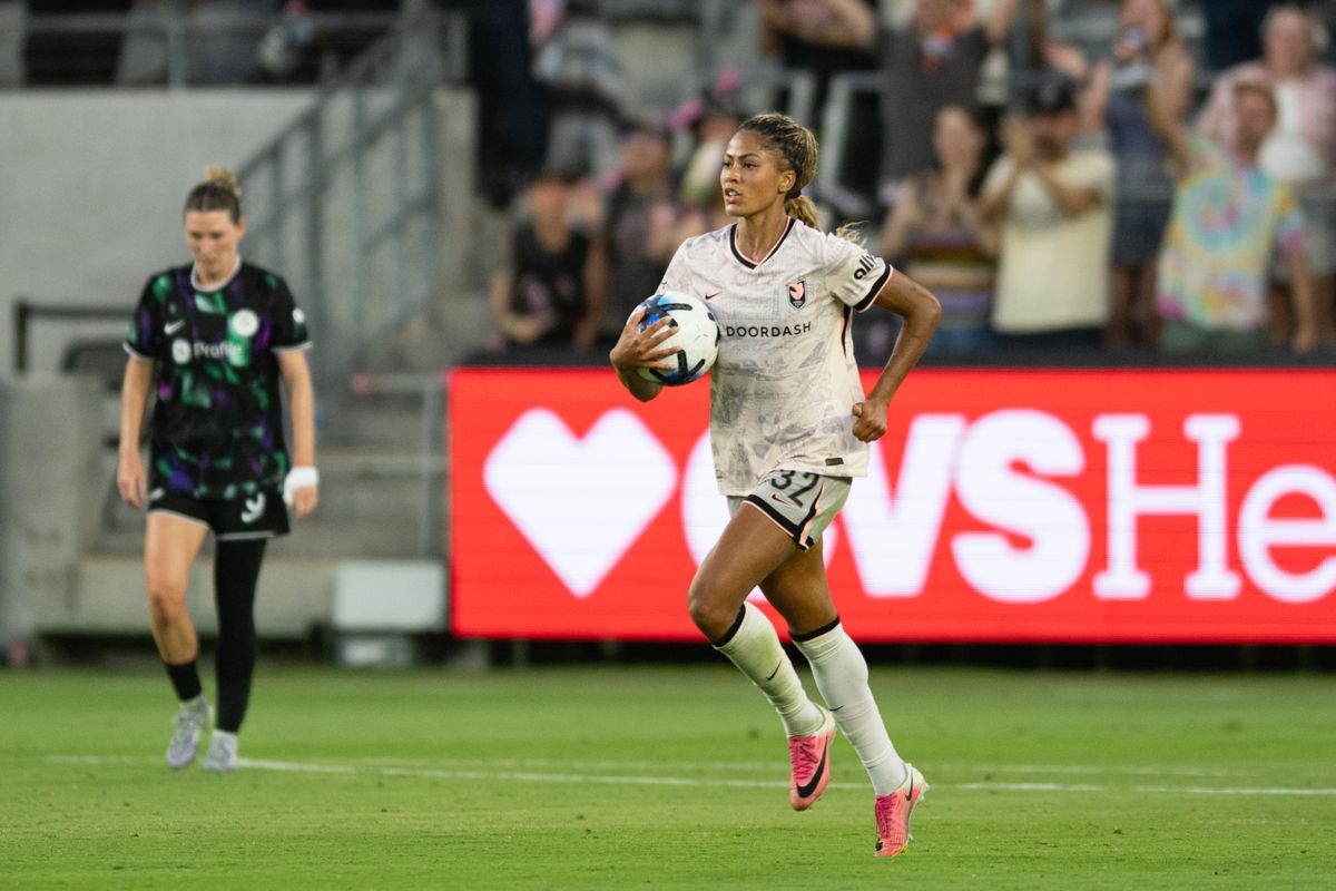 Angel City FC forward Sveindis Jonsdottir (32) carries the ball back to centerfield after scoring a goal during an NWSL match between Racing Louisville FC and Angel City FC on Sunday, July 27, 2026 at BMO Stadium, Los Angeles Calif