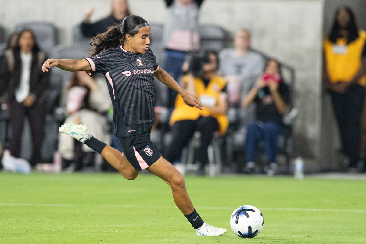 Angel City FC midfielder Taylor Suarez (99) sets up a cross during an NWSL soccer game against Bay FC, Saturday, October 24, 2026 in Los Angeles. Angel City FC midfielder Taylor Suarez (99) sets up a cross during an NWSL soccer game against Bay FC, Saturday, October 24, 2026 in Los Angeles.