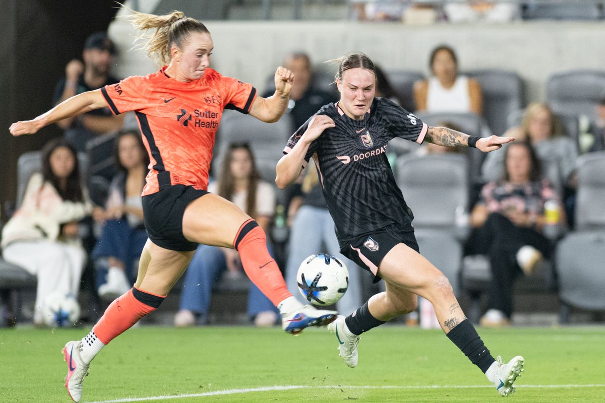 Bay FC defender Aldana Cometti (21) blocks a pass to Angel City FC midfielder Maiara Niehues (12) during an NWSL soccer game against Angel City FC, Saturday, October 24, 2026 in Los Angeles. Bay FC defender Aldana Cometti (21) blocks a pass to Angel City FC midfielder Maiara Niehues (12) during an NWSL soccer game against Angel City FC, Saturday, October 24, 2026 in Los Angeles.