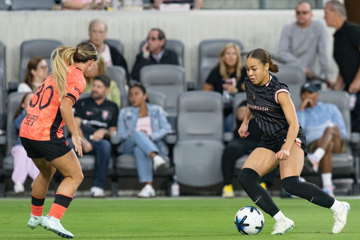 Angel City FC defender Savy King (3) goes head to head with Bay FC midfielder Agostina Holzlieier (30) during an NWSL soccer game against Bay FC, Saturday, October 24, 2026 in Los Angeles. Angel City FC defender Savy King (3) goes head to head with Bay FC midfielder Agostina Holzlieier (30) during an NWSL soccer game against Bay FC, Saturday, October 24, 2026 in Los Angeles.