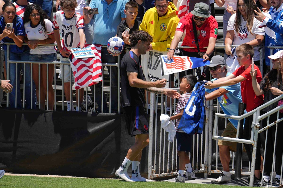 USMNT forward Christian Pulisic (#10) signs autographs for fans during a training session in Irvine, California, on June 8, 2026, ahead of the 2026 FIFA World Cup. USMNT forward Christian Pulisic (#10) signs autographs for fans during a training session in Irvine, California, on June 8, 2026, ahead of the 2026 FIFA World Cup.