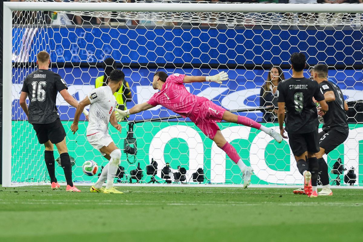 Mohammad Mohebbi #8 of Iran watches his shot go into the net for a goal as Max Crocombe #1 of New Zealand tries to make the save during a 2026 FIFA World Cup match, Monday June 15, 2026 in Inglewood, Calif.