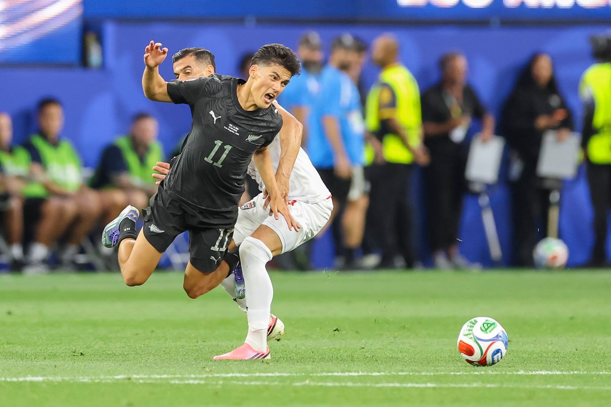 Elijah Just #11 of New Zealand gets tripped while chasing the ball during a 2026 FIFA World Cup match against Iran, Monday June 15, 2026 in Inglewood, Calif.