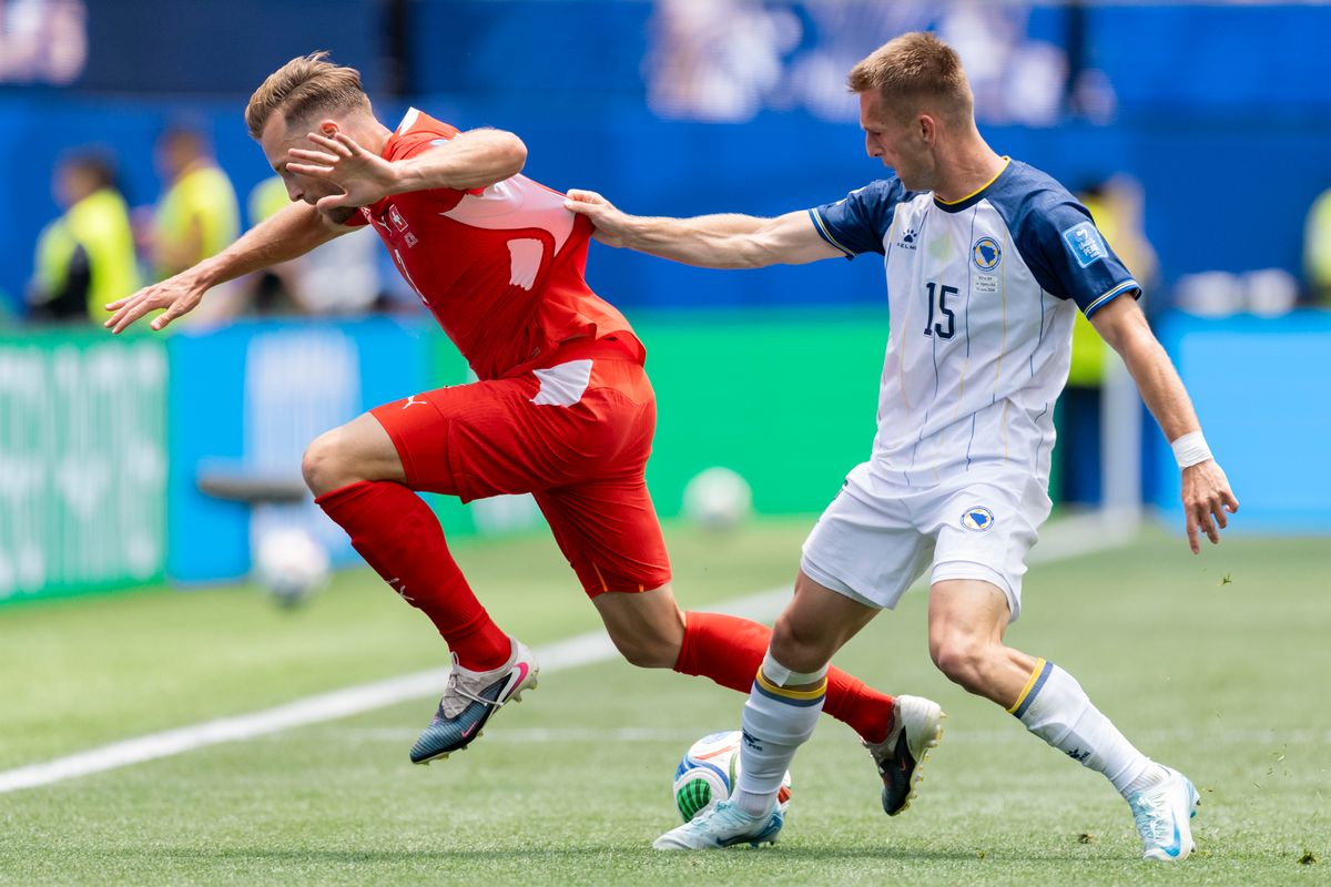 Amar Memić #15 of Bosnia and Herzegovina and Silvan Widmer #3 of Switzerland battle for the ball during a 2026 FIFA World Cup match, Thursday June 18, 2026 in Inglewood, Calif. Amar Memić #15 of Bosnia and Herzegovina and Silvan Widmer #3 of Switzerland battle for the ball during a 2026 FIFA World Cup match, Thursday June 18, 2026 in Inglewood, Calif.