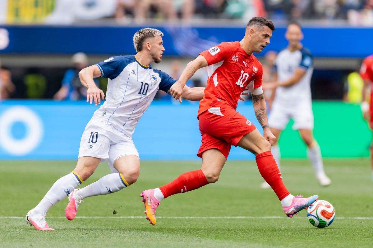 Ermedin Demirović #10 of Bosnia and Herzegovina and Granit Xhaka #10 of Switzerland chase the ball during a 2026 FIFA World Cup match, Thursday June 18, 2026 in Inglewood, Calif. Ermedin Demirović #10 of Bosnia and Herzegovina and Granit Xhaka #10 of Switzerland chase the ball during a 2026 FIFA World Cup match, Thursday June 18, 2026 in Inglewood, Calif.