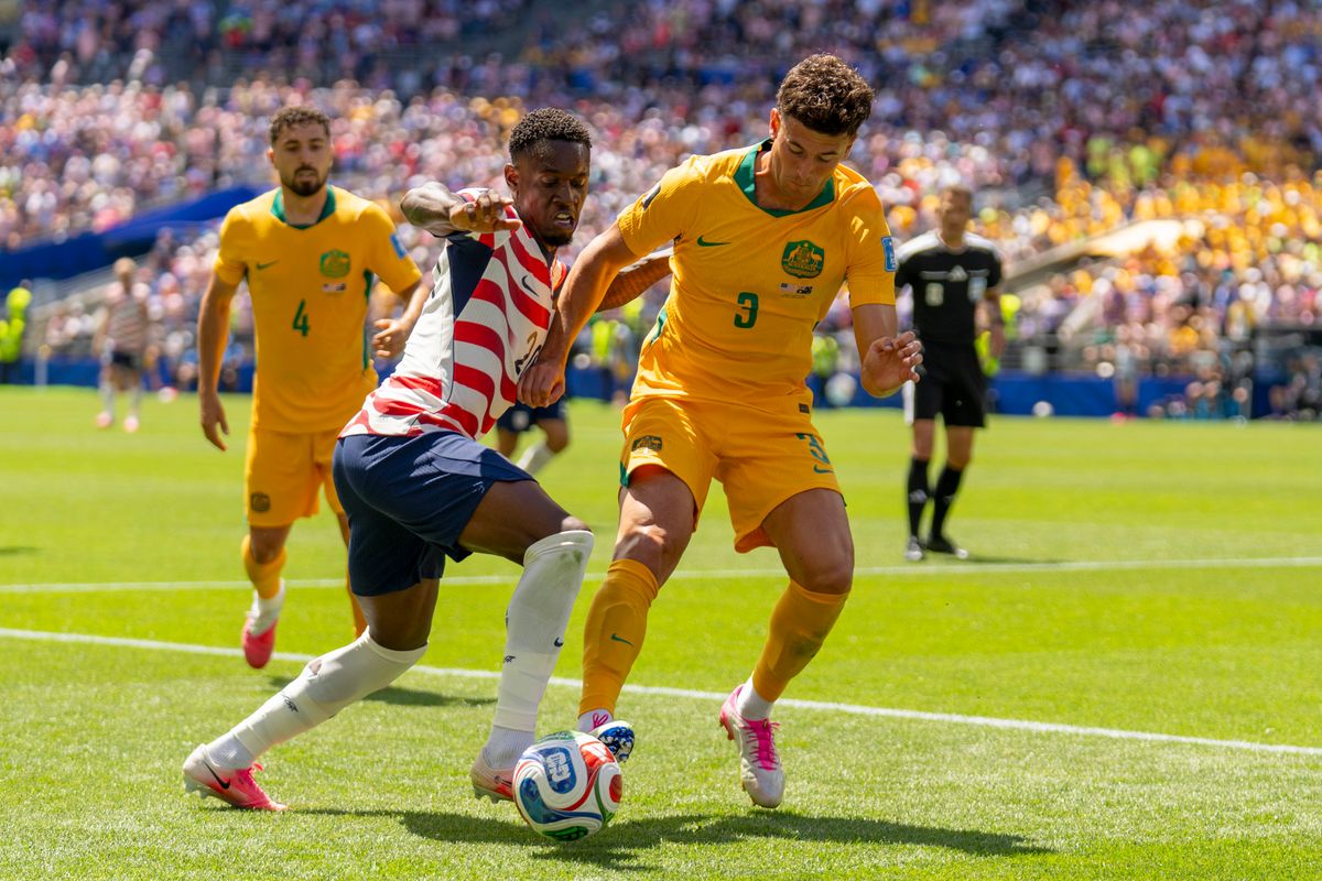 #3 Alessandro Circati of Australia wrestles the ball away from #20 Folarin Balogun of the United States during a FIFA World Cup match against the United States, Friday June 19th, 2026 in Seattle, Washington. #3 Alessandro Circati of Australia wrestles the ball away from #20 Folarin Balogun of the United States during a FIFA World Cup match against the United States, Friday June 19th, 2026 in Seattle, Washington.