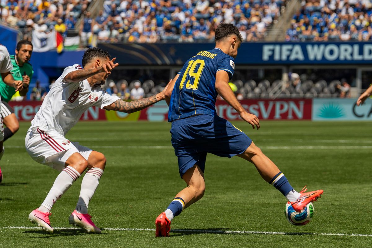#19 Kerim Alajbegovic of Bosnia-Herzegovina beats his defender during a FIFA World Cup match against Qatar, Wednesday June 24th, 2026 in Seattle, Washington. 