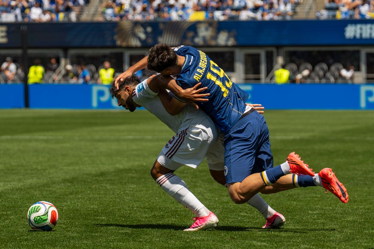 #19 Kerim Alajbegovic of Bosnia-Herzegovina tackles the defender during a FIFA World Cup match against Qatar, Wednesday June 24th, 2026 in Seattle, Washington. 
