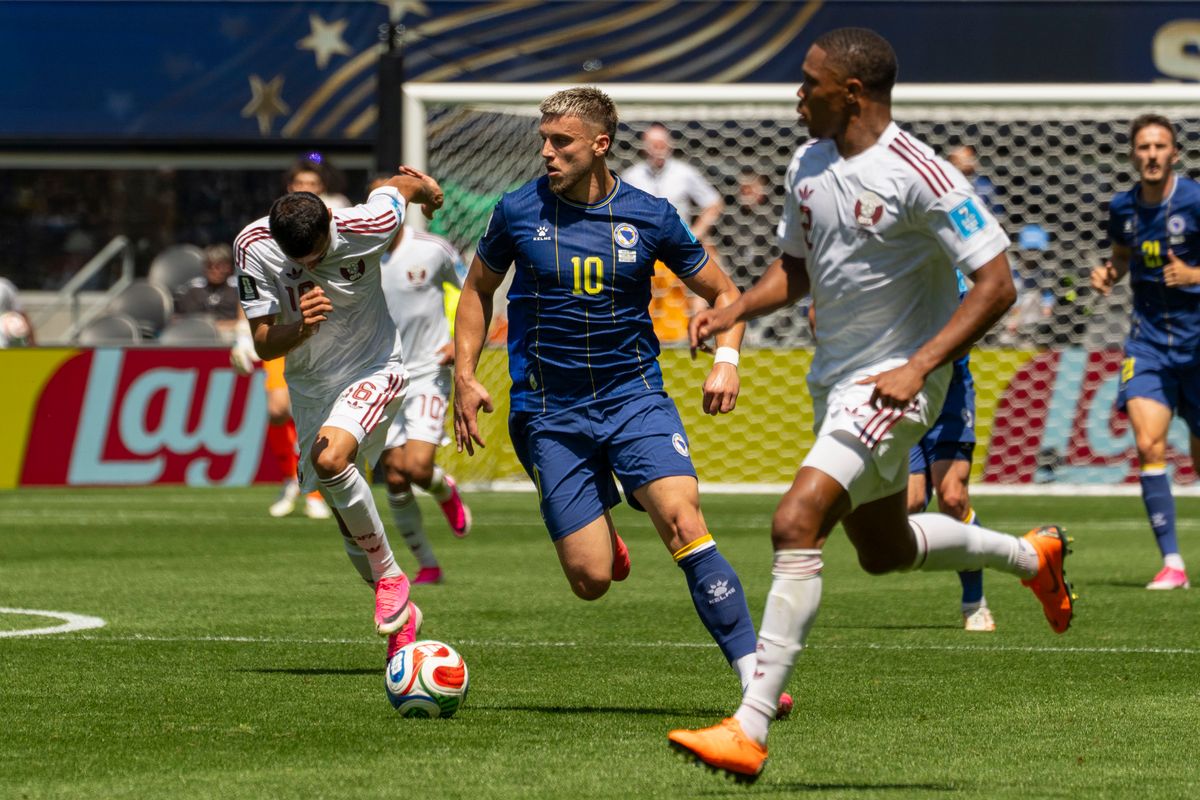 #10 Ermedin Demirovic of Bosnia-Herzegovina beats his defender during a FIFA World Cup match against Qatar, Wednesday June 24th, 2026 in Seattle, Washington. 