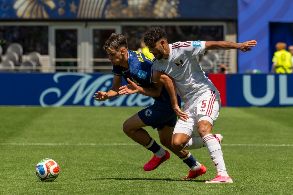 #5 Jassem Gaber of Qatar and #19 Kerim Alajbegovic of Bosnia-Herzegovina fight for possession during a FIFA World Cup match between Qatar and Bosnia-Herzegovina, Wednesday June 24th, 2026 in Seattle, Washington. 