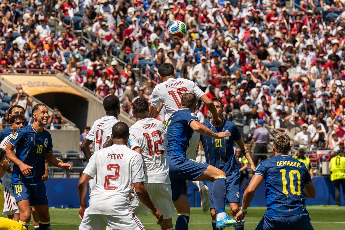 #16 Boualem Khoukhi of Qatar wins the header during a FIFA World Cup match against  Bosnia-Herzegovina, Wednesday June 24th, 2026 in Seattle, Washington. 