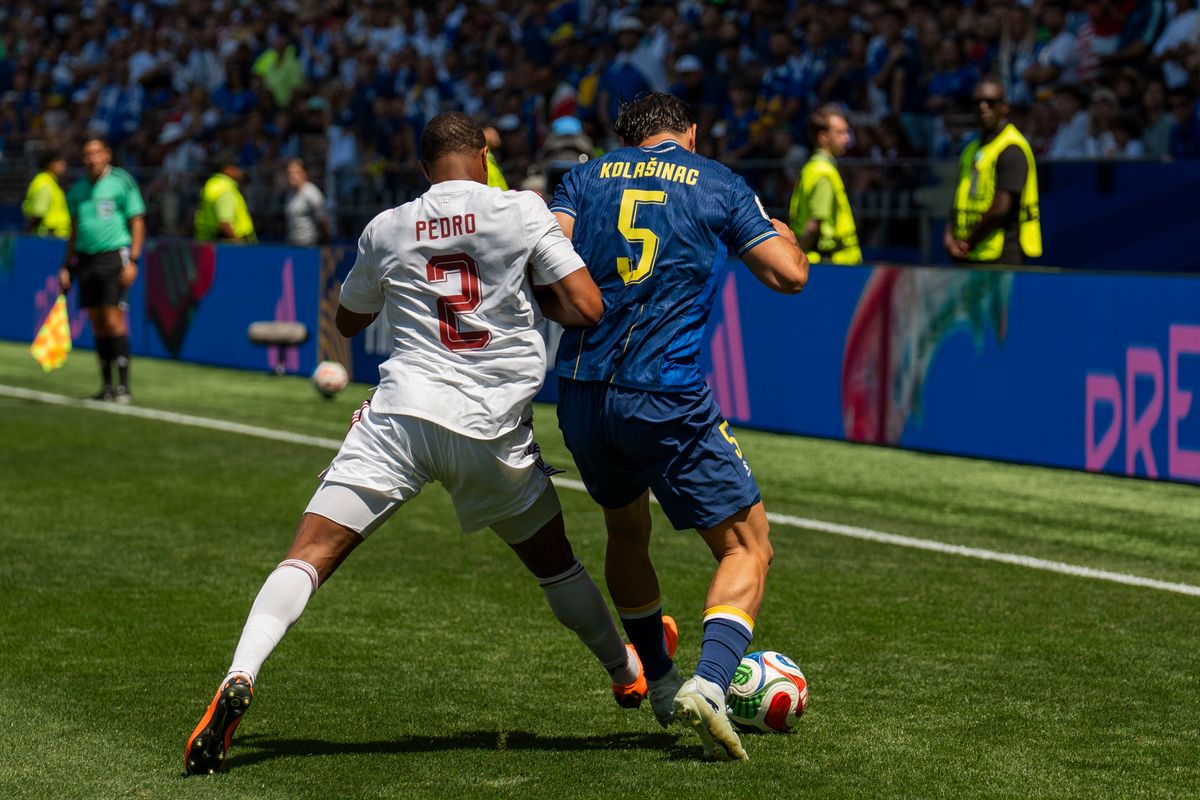 #2 Pedro Miguel of Qatar and #5 Sead Kolasinac of Bosnia-Herzegovina fight for possession during a FIFA World Cup match between Qatar and Bosnia-Herzegovina, Wednesday June 24th, 2026 in Seattle, Washington. 