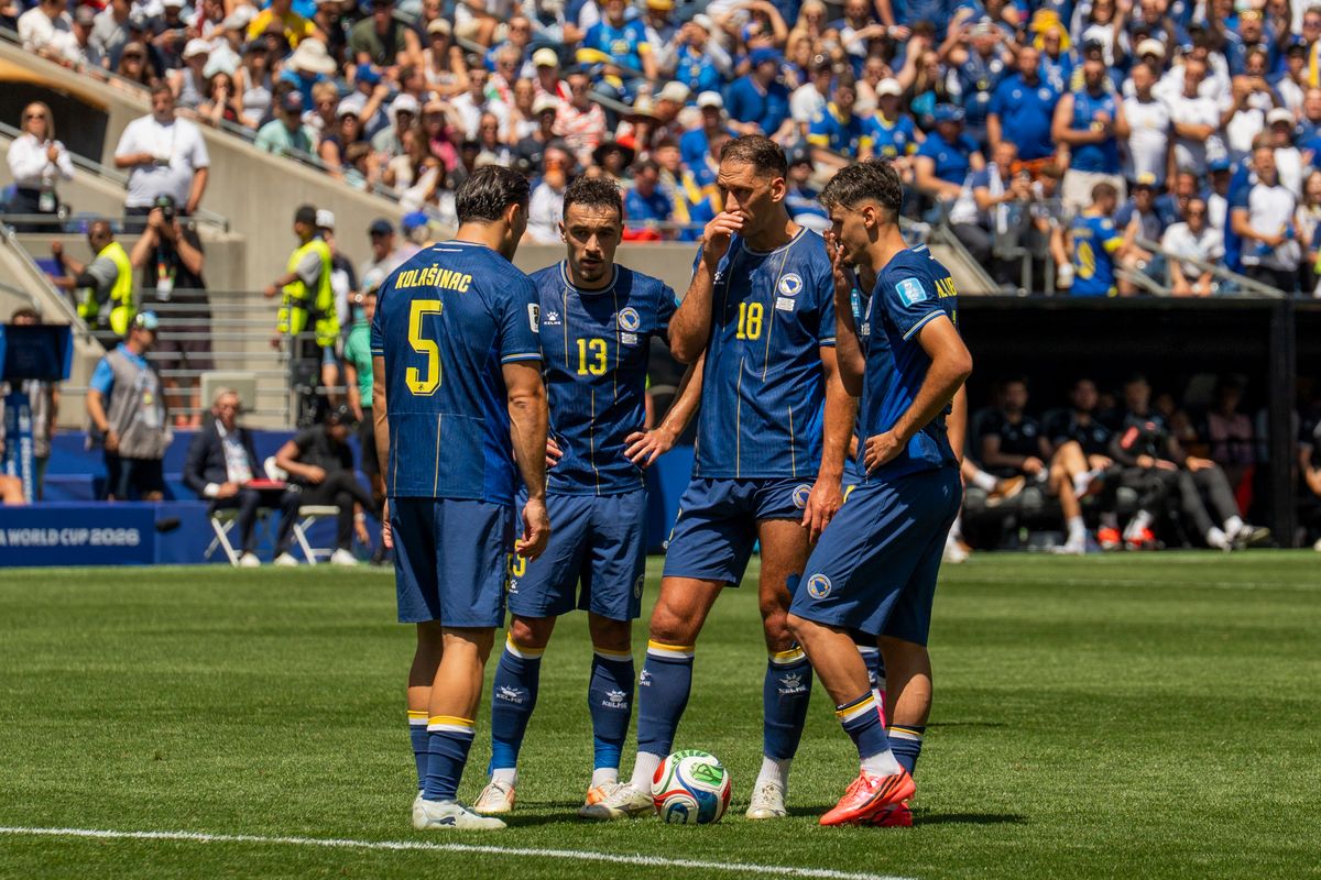 Bosnia-Herzegovina players huddle up before a free kick during a FIFA World Cup match against Qatar, Wednesday June 24th, 2026 in Seattle, Washington. 