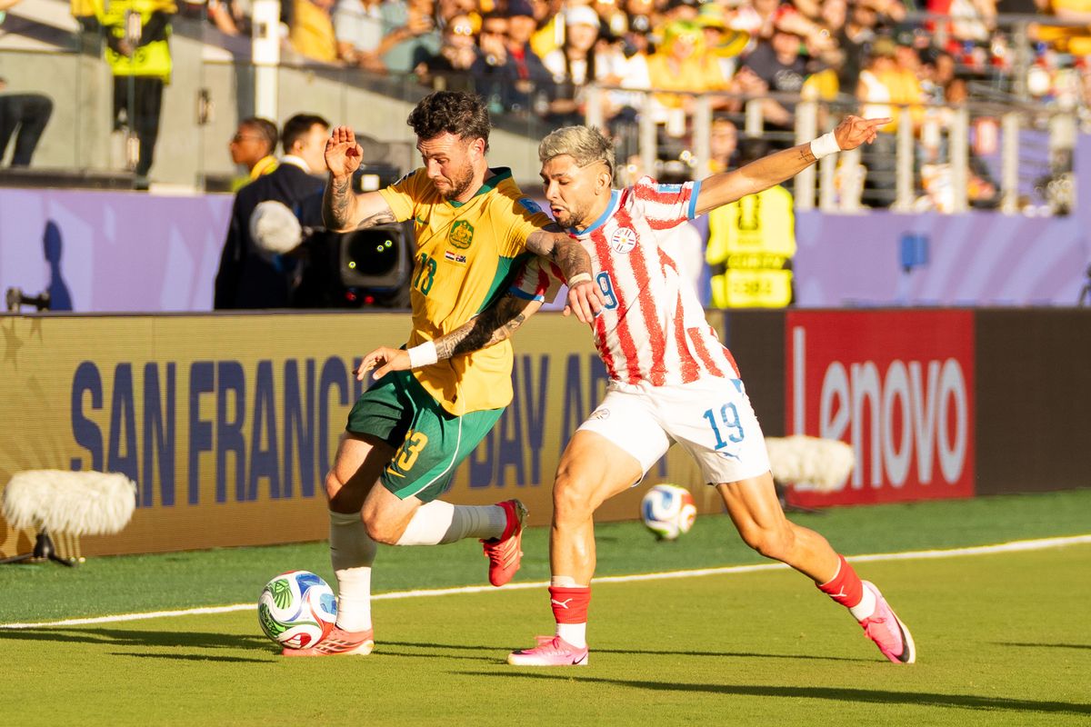 Aiden Oneill (13) of  Australia fights for the ball during a 2026 FIFA World Cup match against Paraguay, Thursday June 25th, 2026 in Santa Clara, Calif.