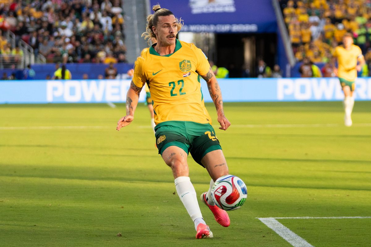 Jackson Irvine (22) of  Australia looks for the open teammate during a 2026 FIFA World Cup match against Paraguay, Thursday June 25th, 2026 in Santa Clara, Calif.