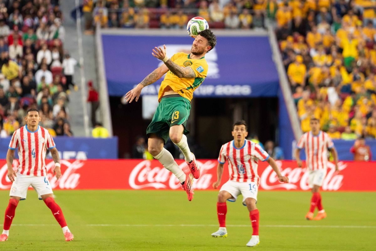 Aiden Oneill (13) of  Australia goes for the header during a 2026 FIFA World Cup match against Paraguay, Thursday June 25th, 2026 in Santa Clara, Calif.