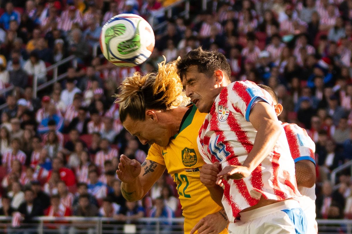 Jackson Irvine (22) of  Australia goes for the header during a 2026 FIFA World Cup match against Paraguay, Thursday June 25th, 2026 in Santa Clara, Calif.