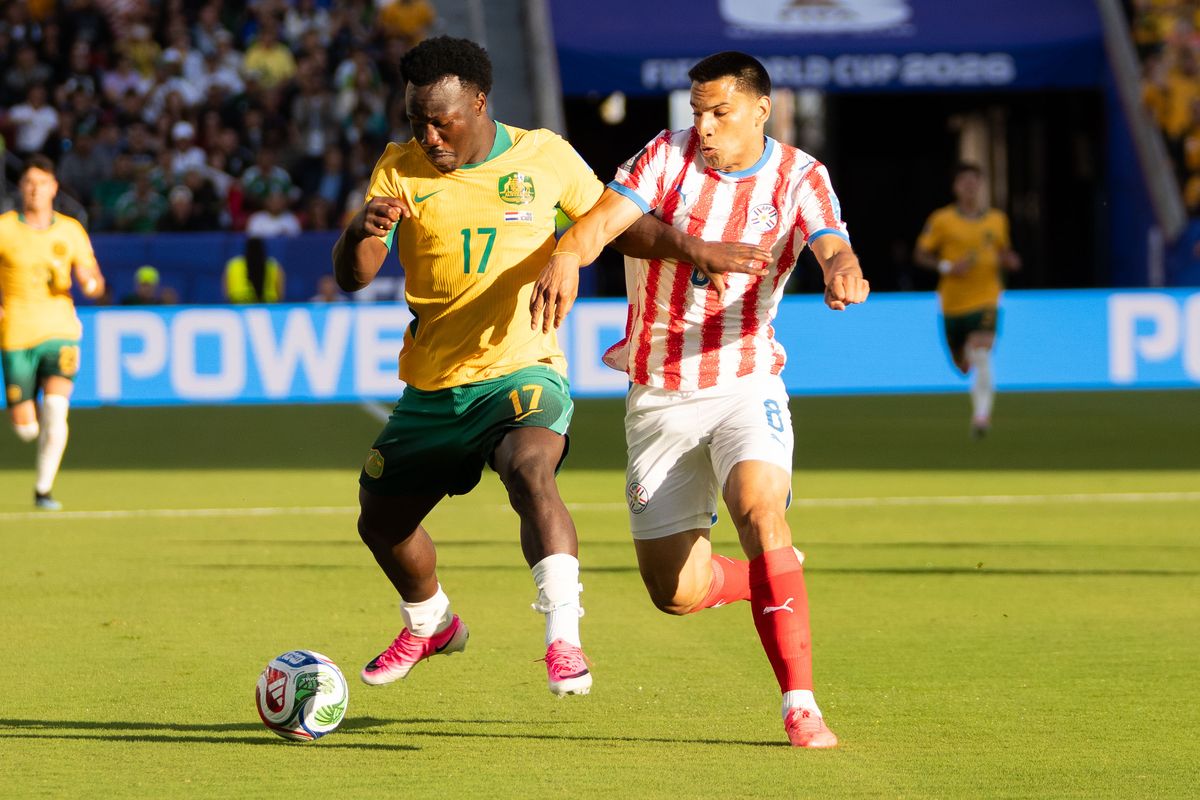 Nestory Irakunda (17) of  Australia fights for possession during a 2026 FIFA World Cup match against Paraguay, Thursday June 25th, 2026 in Santa Clara, Calif.