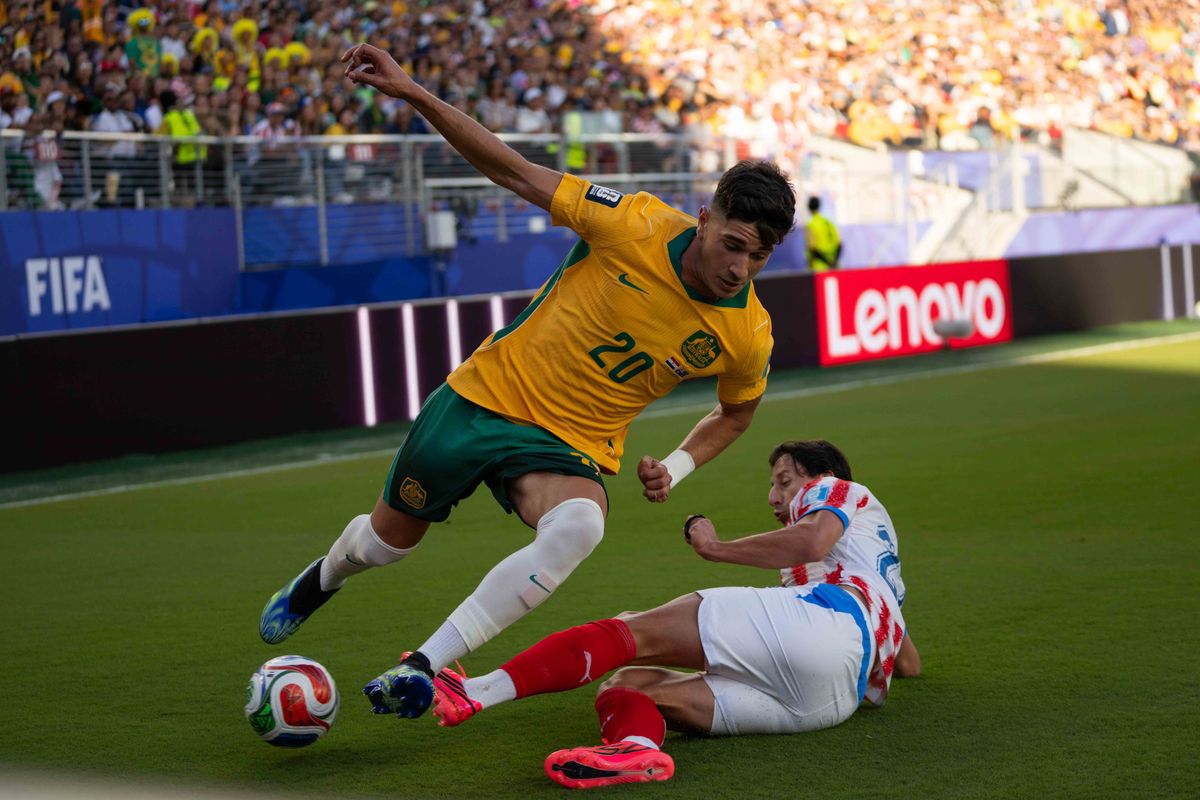 Cristian Volpato (20) of  Australia avoids a tackle during a 2026 FIFA World Cup match against Paraguay, Thursday June 25th, 2026 in Santa Clara, Calif.