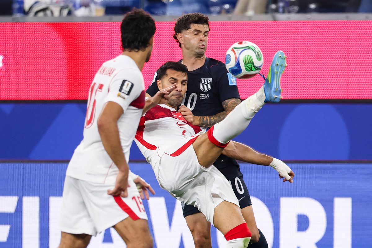 Zeki Çelik #2 of Türkiye kicks the ball in front of Christian Pulisic #10 of the United States during a 2026 FIFA World Cup match, Thursday June 25, 2026 in Inglewood, Calif.