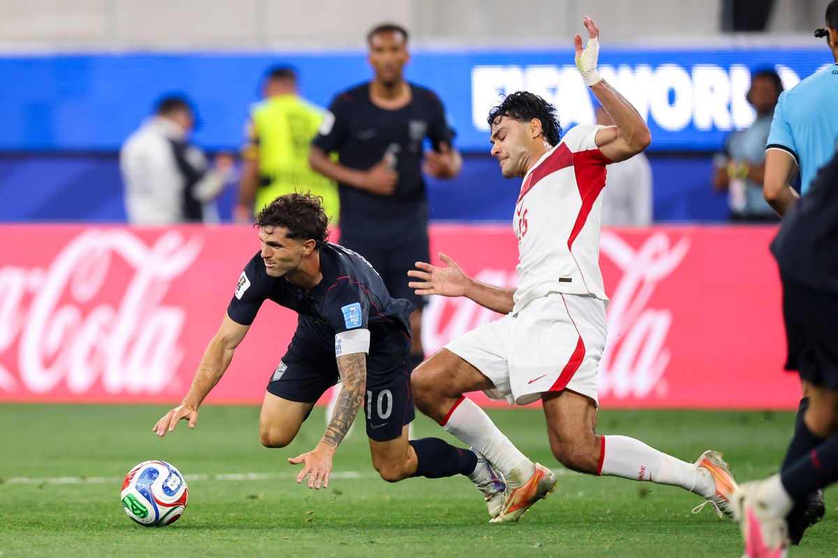 Christian Pulisic #10 of the United States is pushed down by Ozan Kabak #15 of Türkiye during a 2026 FIFA World Cup match, Thursday June 25, 2026 in Inglewood, Calif.