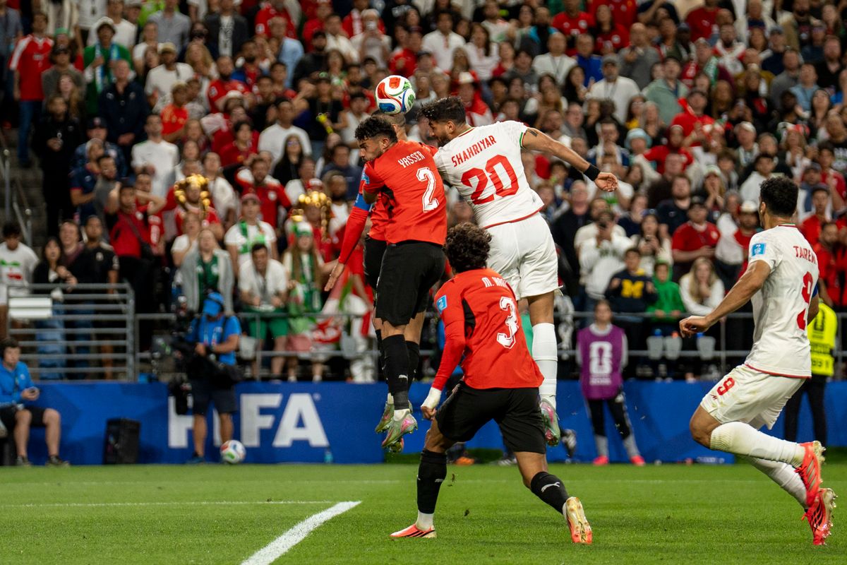#2 Yassir Ibrahim Mohamed Salah of Egypt and #20 Shahriyar Moghanloo of Iran fight for a header during a FIFA World Cup match between Egypt and Iran, Friday June 26th, 2026 in Seattle, Washington. 
