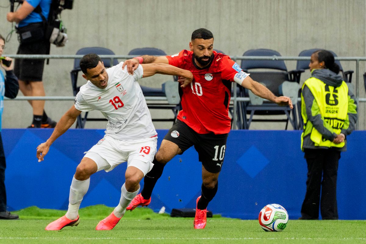 #10 Mohamed Salah of Egypt and #19 Ali Nemati of Iran fight for possession during a FIFA World Cup match between Egypt and Iran, Friday June 26th, 2026 in Seattle, Washington. 