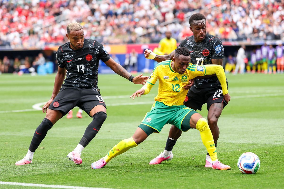 Thapelo Maseko #12 of South Africa, Derek Cornelius #13 of Canada, and Richie Laryea #22 of Canada compete for the ball during a 2026 FIFA World Cup match, Sunday June 28, 2026 in Inglewood, Calif.