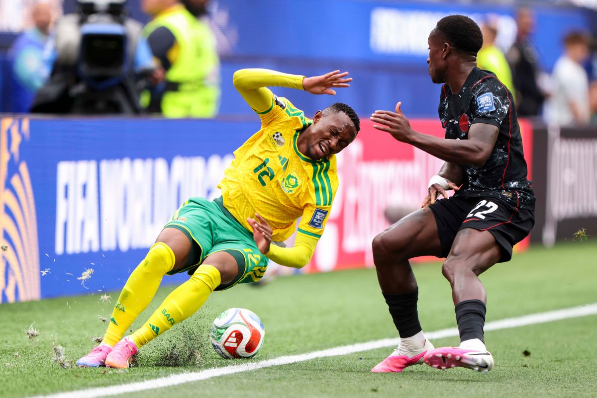 Thapelo Maseko #12 of South Africa falls while chasing the ball as Richie Laryea #22 of Canada defends during a 2026 FIFA World Cup match, Sunday June 28, 2026 in Inglewood, Calif.