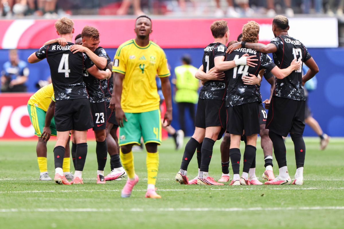 Canada players celebrate the victory as Teboho Mokoena #4 of South Africa walks away after a 2026 FIFA World Cup match, Sunday June 28, 2026 in Inglewood, Calif.