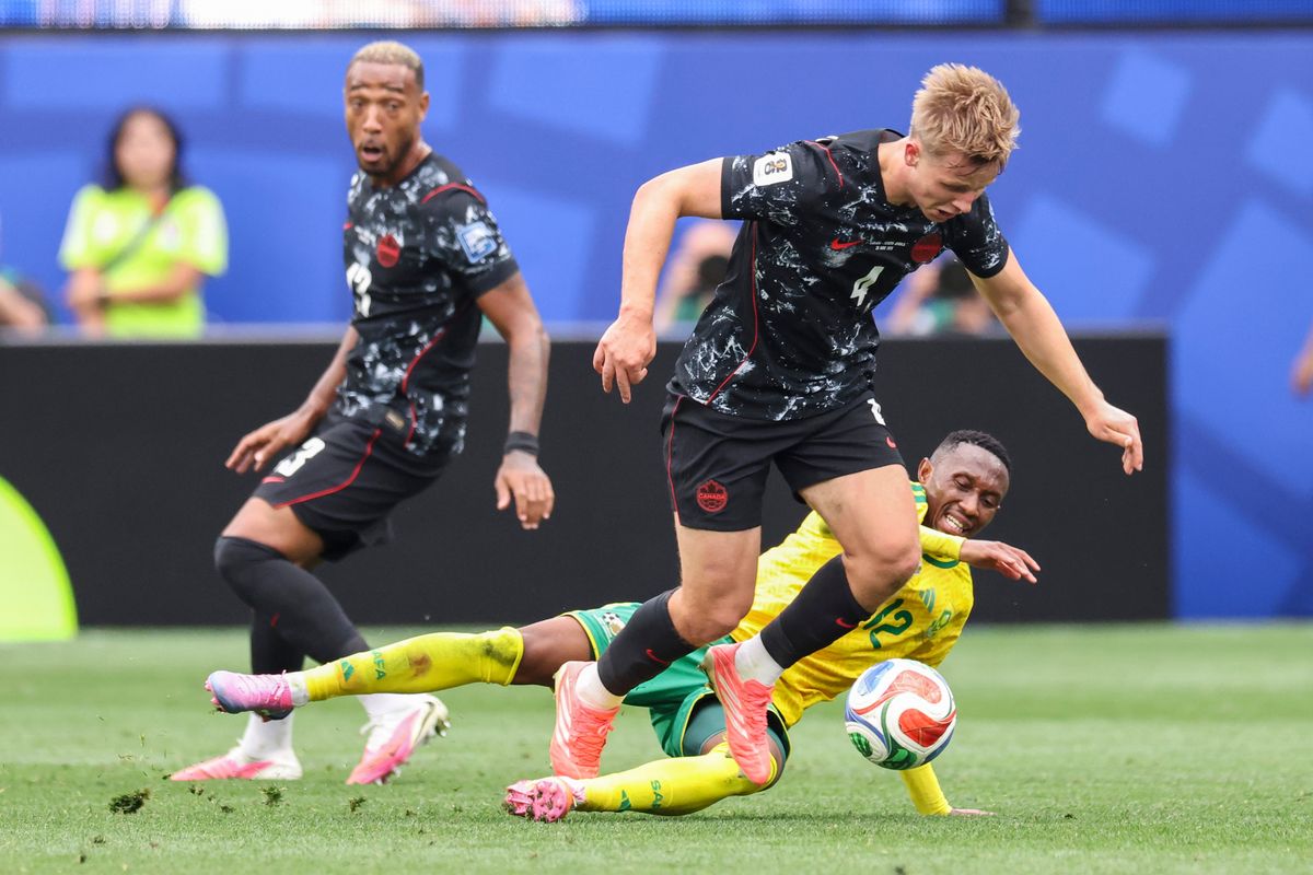 Luc de Fougerolles #4 of Canada and Thapelo Maseko #12 of South Africa fight for the ball during a 2026 FIFA World Cup match, Sunday June 28, 2026 in Inglewood, Calif.