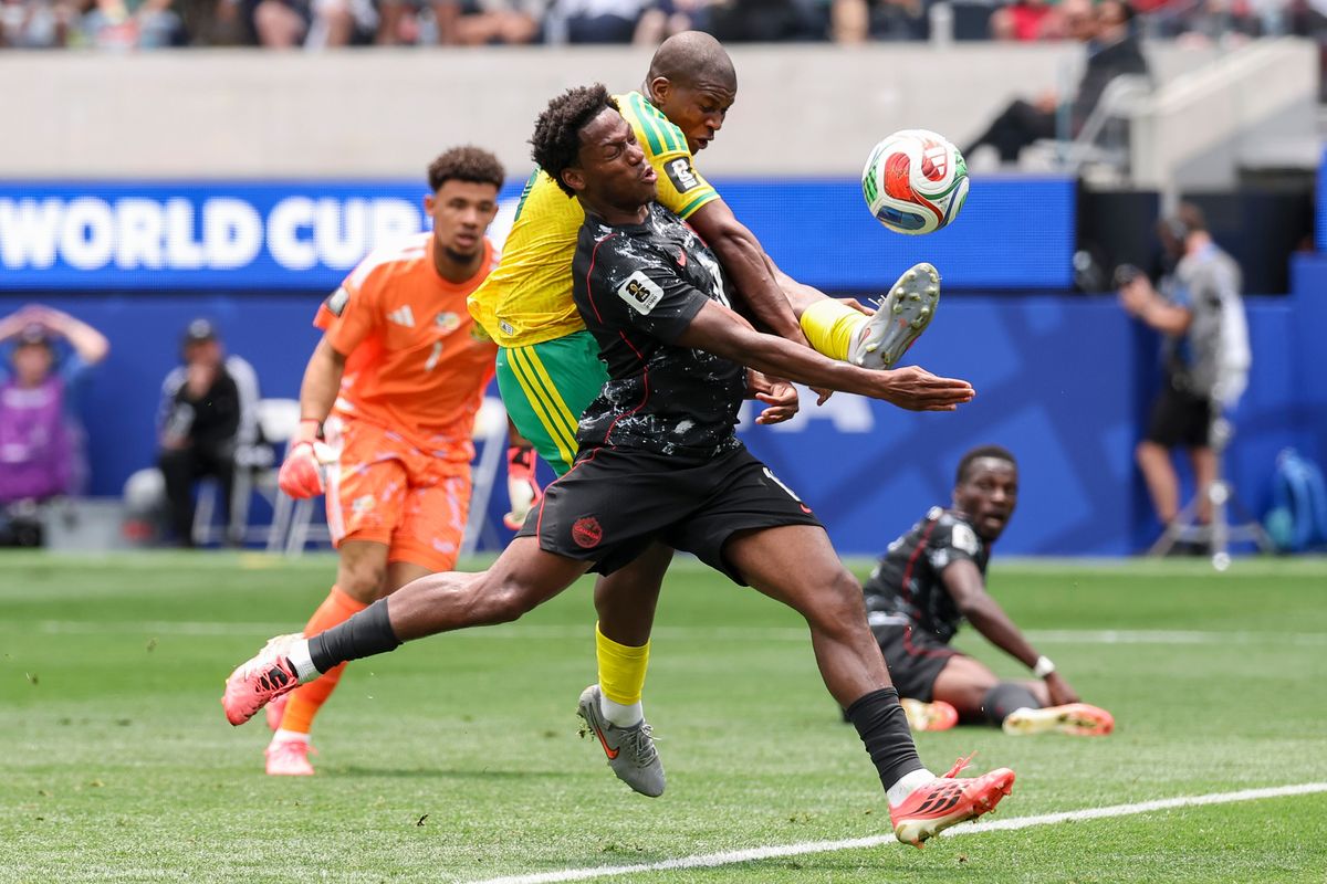 Mbekezeli Mbokazi #14 of South Africa kicks the ball away to prevent a shot attempt by Jonathan David #10 of Canada during a 2026 FIFA World Cup match, Sunday June 28, 2026 in Inglewood, Calif.