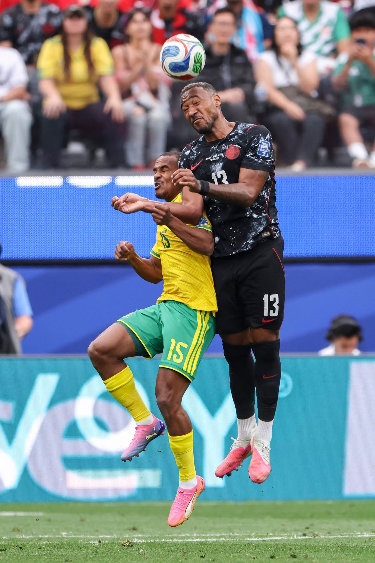 Iqraam Rayners #15 of South Africa and Derek Cornelius #13 of Canada compete for a header during a 2026 FIFA World Cup match, Sunday June 28, 2026 in Inglewood, Calif.