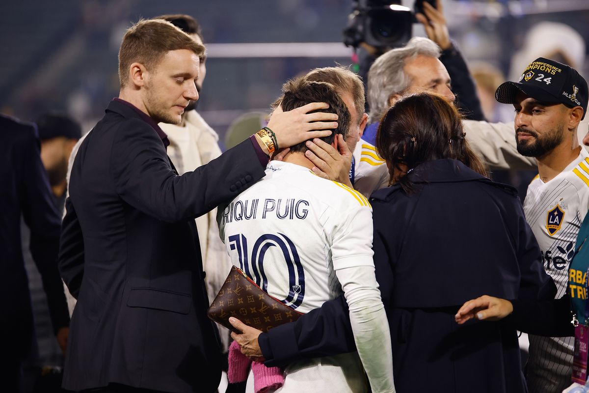 LA Galaxy Midfielder Riqui Puig (10) being consoled by his parents after discussing injury after match against Seattle Sounders FC on Saturday, November 30, 2024 in Carson, CA.