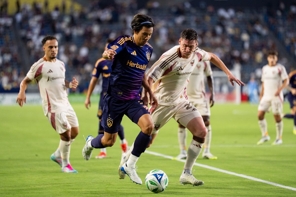 Los Angeles Galaxy defender Miki Yamane (2) fights off a player during an MLS match against D.C. United, Saturday July 12, 2025 in Carson, Calif.