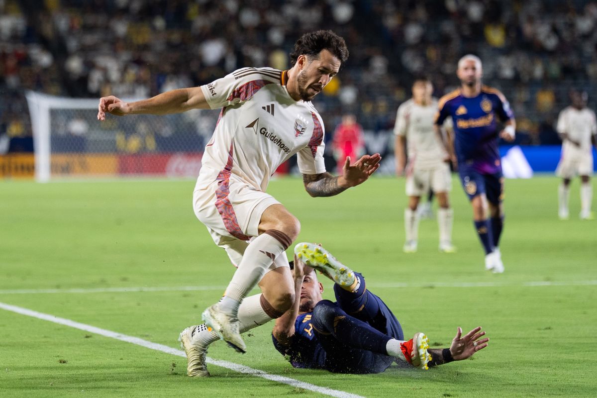 Los Angeles Galaxy forward Gabriel Pec (11) slide tackles during an MLS match against D.C. United, Saturday July 12, 2025 in Carson, Calif.