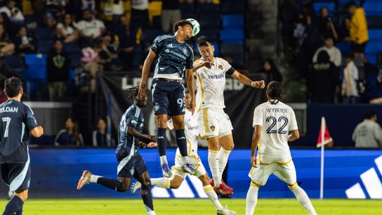 Seattle Sounders forward Osaze De Rosario (95) and Los Angeles Galaxy defender Maya Yoshida (4) jump for the ball during the Sounders 4-0 win over LA on Sunday, August 10, 2025, in Carson, Calif.
