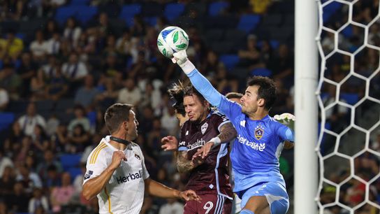 Los Angeles Galaxy goalkeeper JT Marcinkowski (12) punches the ball away during the Galaxy's 3-0 home win against the Colorado Rapids, Saturday August 23, 2025 in Carson, California.