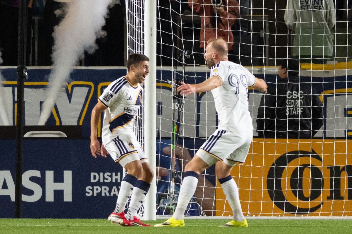 LA Galaxy midfielder Lucas Sanabria (8) celebrates with forward João Klauss (99) after scoring a goal during an MLS game between LA Galaxy and Charlotte FC on Saturday, February 28, 2026 at Dignity Health Sports Park in Carson, Calif.