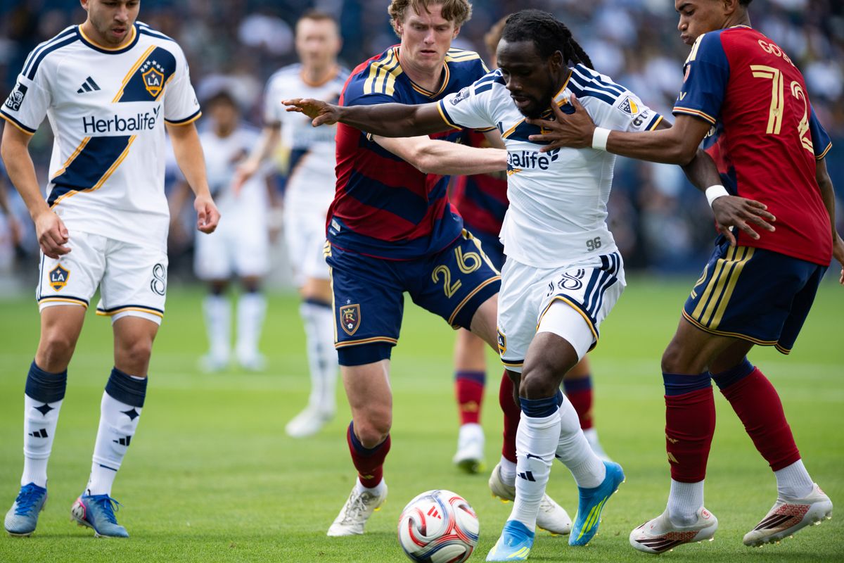 LA Galaxy forward Joseph Paintsil (28) fights off two defenders during a match between Real Salt Lake and LA Galaxy on Sunday, April 26, at Dignity Health Sports Park in Carson California