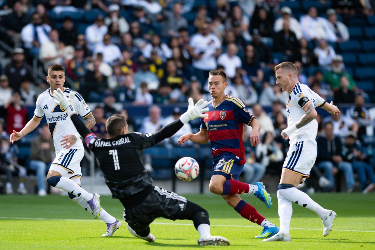 LA Galaxy midfielder Marco Reus (18) attempt at goal is saved by Real Salt Lake goalkeeper Rafael (1) during a match between Real Salt Lake and LA Galaxy on Sunday, April 26, at Dignity Health Sports Park in Carson California