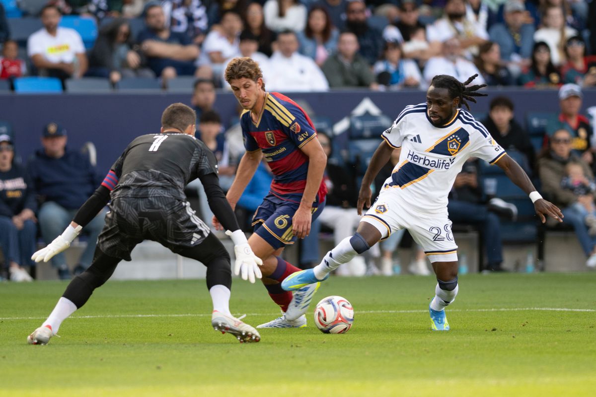 LA Galaxy forward Joseph Paintsil (28) attempts to maneuvers the ball around the goalkeeper during a match between Real Salt Lake and LA Galaxy on Sunday, April 26, at Dignity Health Sports Park in Carson California