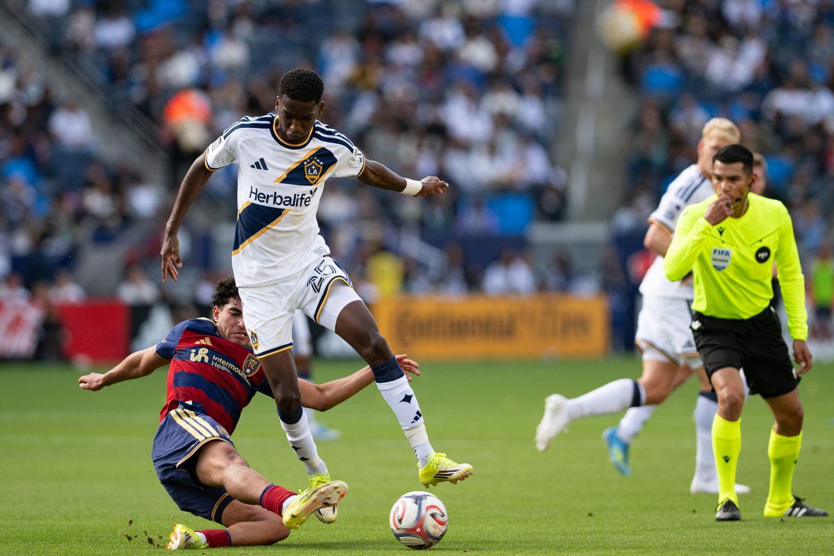 LA Galaxy defender Carlos Garcés (25) jumps over a tackle during a match between Real Salt Lake and LA Galaxy on Sunday, April 26, at Dignity Health Sports Park in Carson California