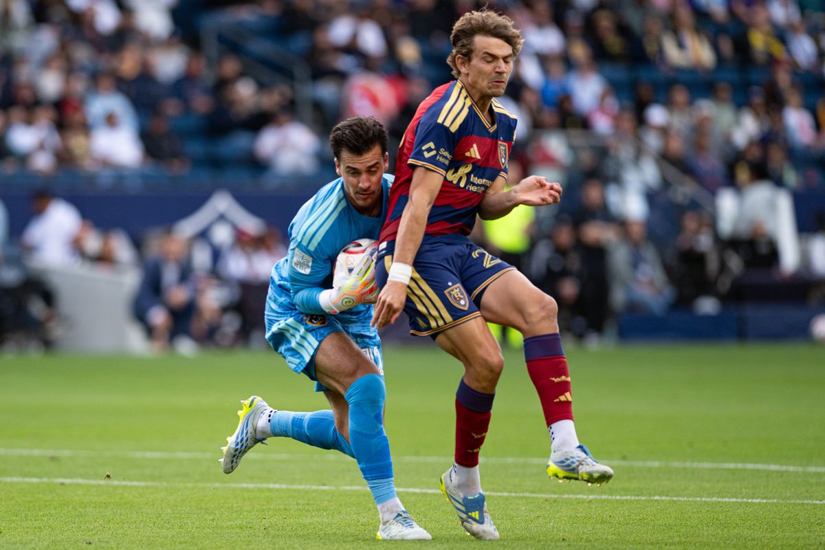 LA Galaxy goalkeeper JT Marcinkowski (12) collides with Real Salt Lake forward Sergi Solans (22) after making a save during a match between Real Salt Lake and LA Galaxy on Sunday, April 26, at Dignity Health Sports Park in Carson California