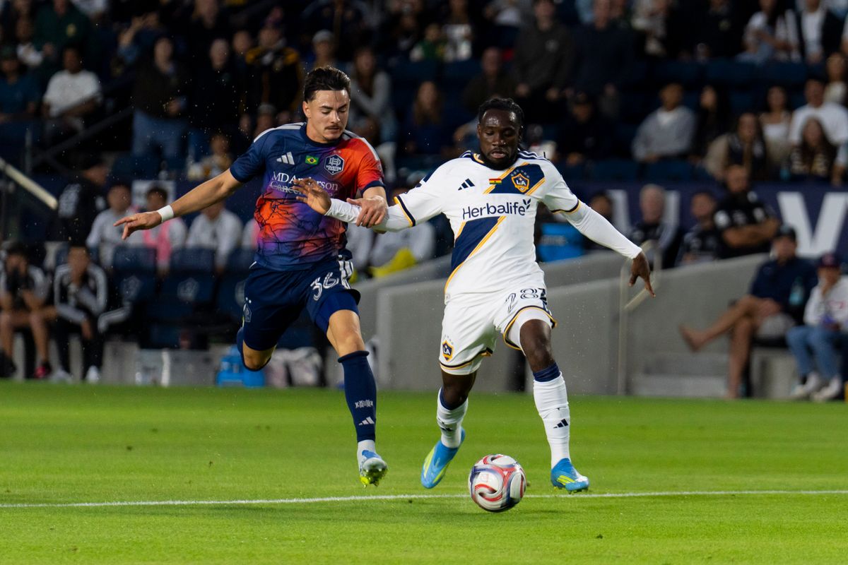 Los Angeles Galaxy forward Joseph Paintsil (11) beats his defender to the ball during an MLS soccer game against the Houston Dynamo FC, Saturday May 23rd, 2026 in Carson, California. Los Angeles Galaxy forward Joseph Paintsil (11) beats his defender to the ball during an MLS soccer game against the Houston Dynamo FC, Saturday May 23rd, 2026 in Carson, California.